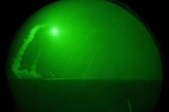 View through night-vision lenses of Tomahawk cruise missiles being fired in the Mediterranean Sea