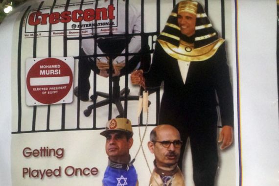 A poster, sold for 8 Egyptian pounds ($1.14), depicts a magazine cover of Obama as a pharaoh controlling Sisi and ElBaradei [D.Parvaz/Al Jazeera]