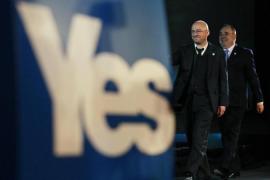 Scotland''s First Minister and leader of the SNP Alex Salmond walks on stage with Scottish Green Party leader Patrick Harvie in Edinburgh