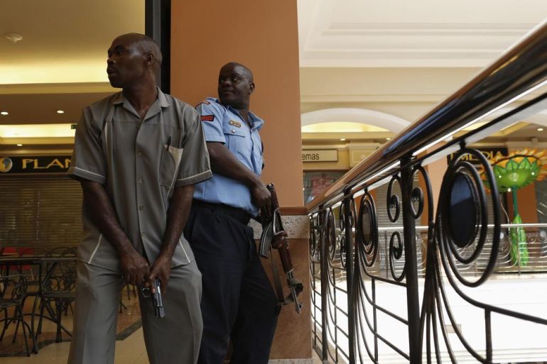 Police officers try to secure an area inside the Westgate Shopping Centre where gunmen went on a shooting spree, in Nairobi