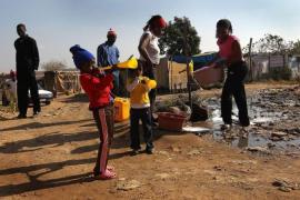 South African Football Fans Gather In Poor Township For World Cup Opening