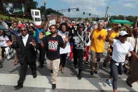 Protests were organised in the US town of Ferguson, Mo after the police shooting of Michael Brown. [AP]