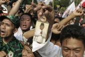 A supporter holds a portrait of losing presidential candidate Prabowo Subianto during a protest near the Constitutional Court in Jakarta, Indonesia [AP]