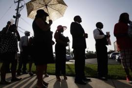 People wait in line to attend the funeral for Michael Brown St. Louis, Missouri [Reuters]