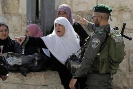 Palestinian women are blocked by Israeli security forces outside the al-Aqsa mosque compound [AFP]
