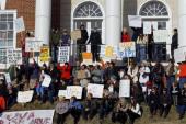 A protest at the Phi Kappa Psi fraternity house at the University of Virginia in Charlottesville [AP]