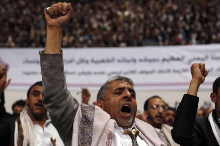 Followers of the Houthi movement shout slogans as they attend a gathering in Sanaa