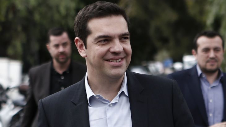 Opposition leader and head of radical leftist Syriza party Tsipras arrives for a meeting with journalists in Athens