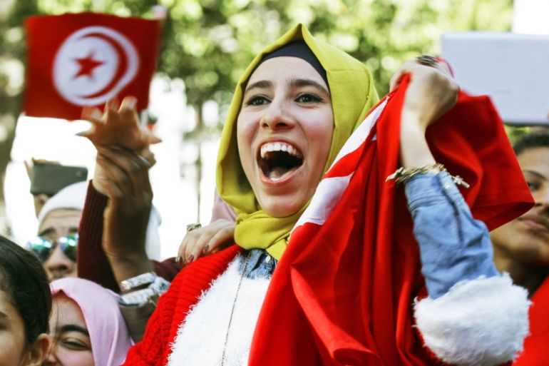 A woman shouts slogans during celebrations marking the fourth anniversary of Tunisia''s 2011 revolution, in Tunis