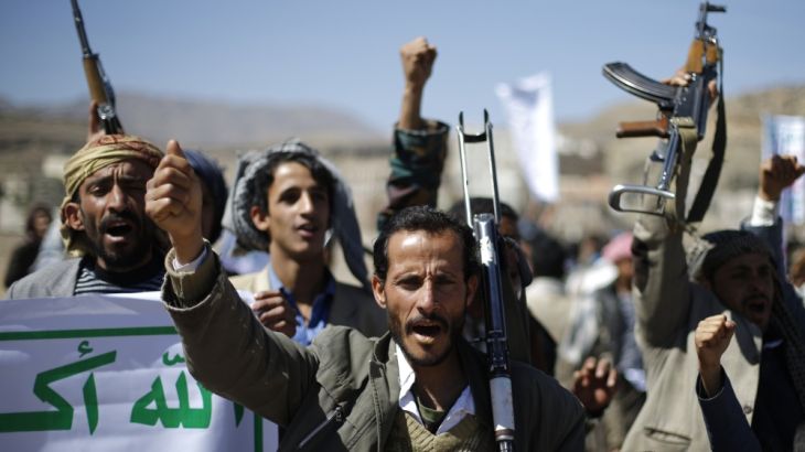 Followers of the Houthi movement shout slogans during a gathering in Sanaa