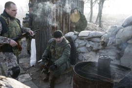 Members of the armed forces of the separatist self-proclaimed Donetsk People''s Republic rest at a checkpoint near Donetsk
