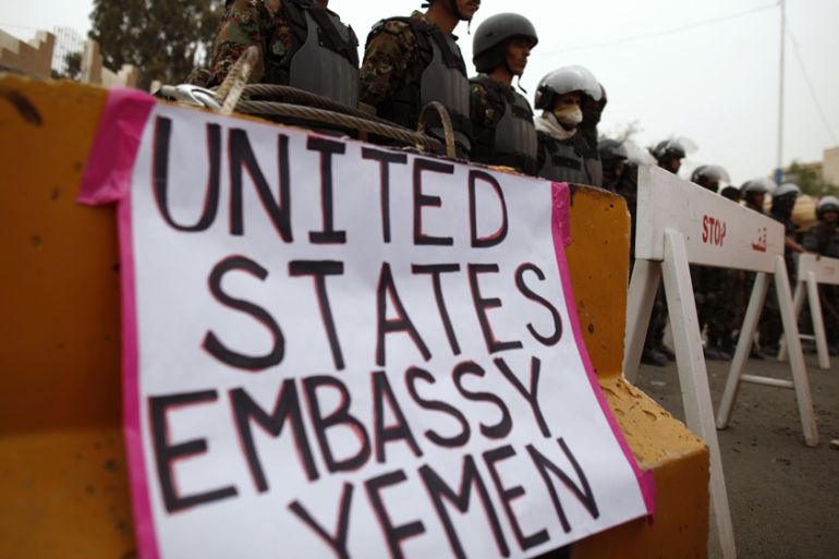 Riot police standing outside the US embassy in Yemen