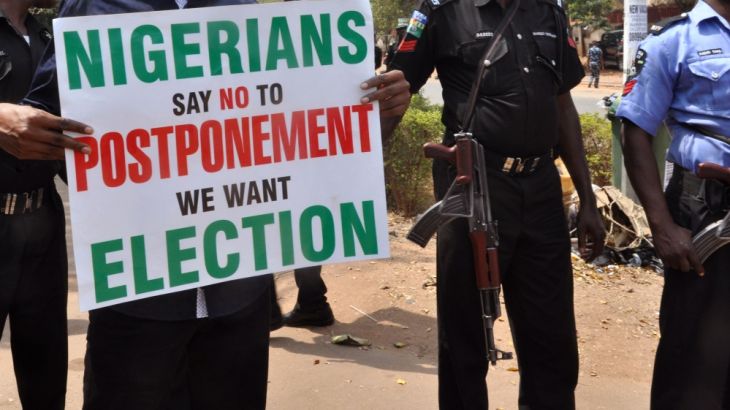 People demonstrate against a decision to postpone Nigeria''s elections