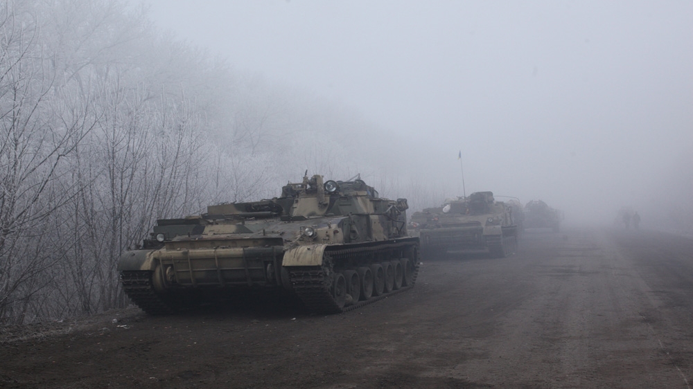 Ukrainian armoured personnel carriers on the road into Debaltseve [John Wendle] 