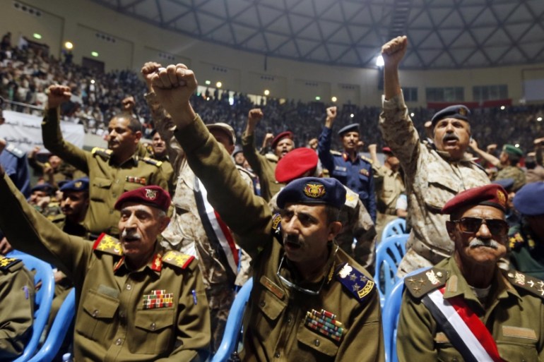 Army and police officers loyal to the Houthis