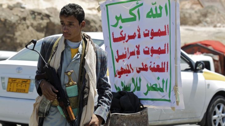 Houthi fighter mans a checkpoint in Sanaa