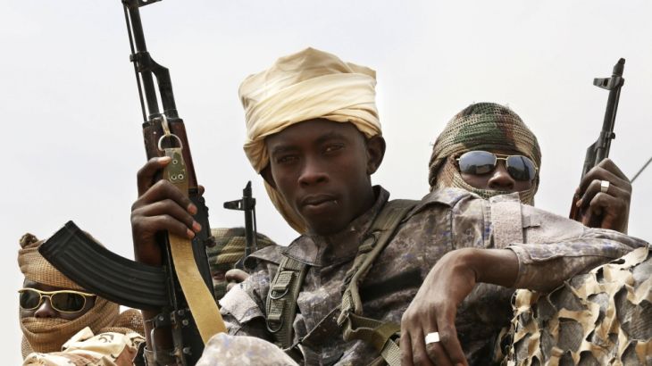 Chadian soldiers ride atop a pickup truck during Flintlock 2015, an American-led military exercise, in Mao