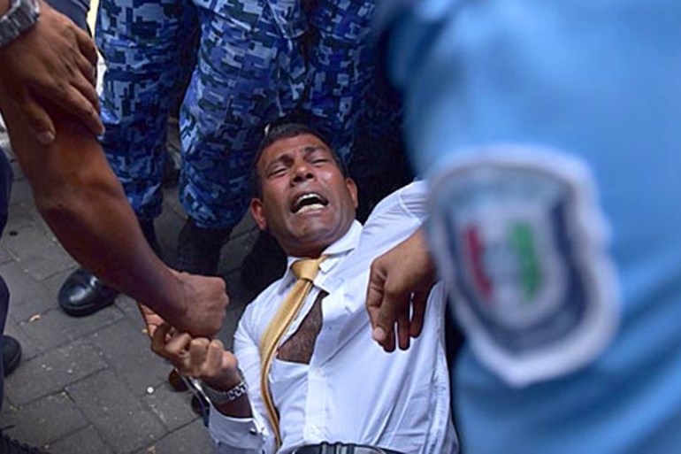 Maldives ex-president dragged into court