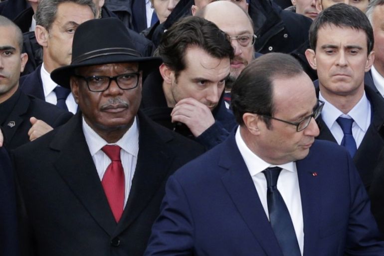 French President Francois Hollande is surrounded by heads of state attends the solidarity march (Marche Republicaine) in the streets of Paris