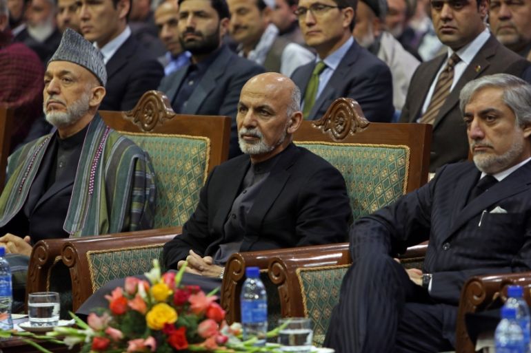 Ghani, Karzai and Abdullah during a ceremony marking the first anniversary of the death of Former Afghan Vice President Marshal Mohammed Qasim Fahim [AP]
