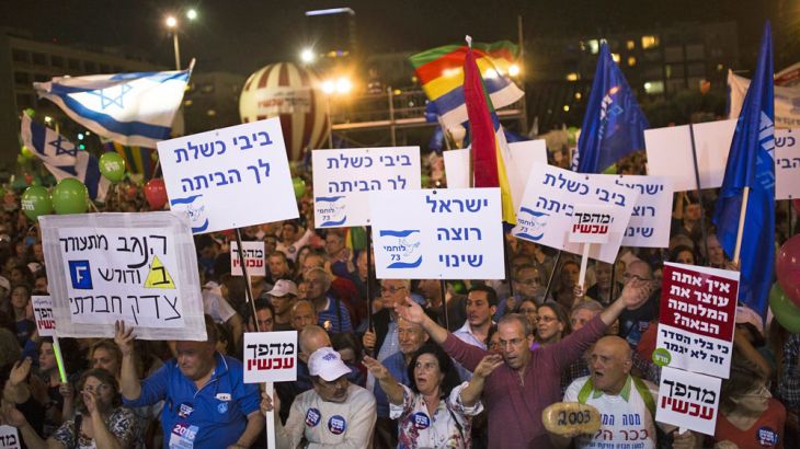 Israelis gather at a rally, calling for a change of Government and to replace Prime Minister Benjamin Netanyahu, at Rabin Square in Tel Aviv