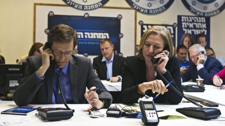Herzog and Livni, leaders of the centre-left Zionist Union party, speak on the phone with potential voters at their party''s headquarters in Tel Aviv