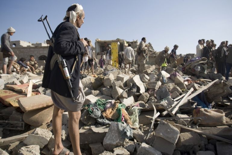 People search for survivors after coalition air strike near Sanaa, Yemen