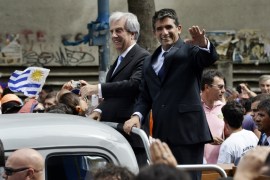 Tabare Vazquez and Raul Sendic wave to the crowd after Vazquez was sworn in as Uruguay''s new president in Montevideo