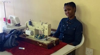 Mandisa Tyabule's work is interupted for hours by electricity cuts [Victoria Schneider/Al Jazeera]