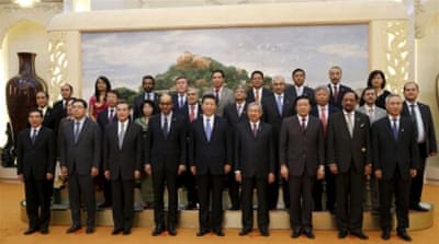 China's president with guests at the Asian Infrastructure Investment Bank launch in Beijing [REUTERS]
