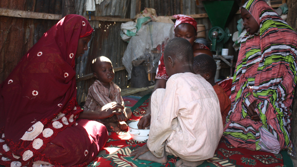 Wasaram Muhammed barely has enough to eat with her children [Chika Oduah/Al Jazeera]