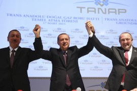 Erdogan poses with his Azerbaijani and Georgian counterparts during the ground-breaking ceremony for TANAP pipeline in Kars, eastern Turkey [REUTERS]