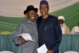 Nigeria''s President Jonathan and former military ruler Buhari embrace after signing a peace accord in Abuja