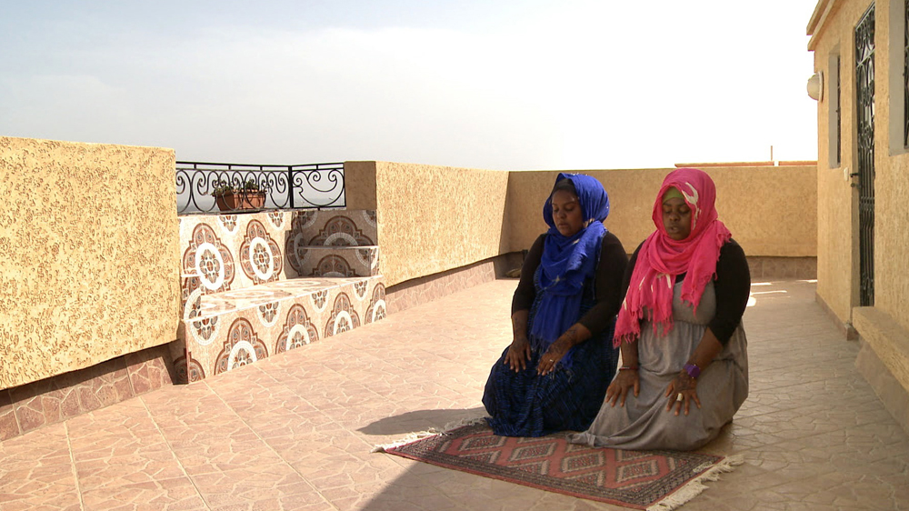 Muneera and Sukina pray in Morocco [Al Jazeera]