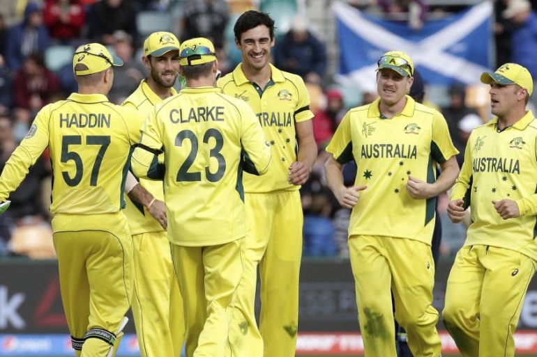 Australia''s Starc is congratulated by team mates after taking the wicket of Scotland''s Davey during their Cricket World Cup match, in Hobart
