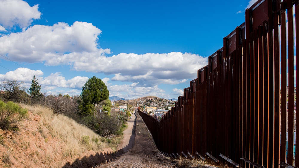 The border wall in Nogales, Arizona is heavily guarded and effective at keeping migrants out [Felix Gaedtke/Al Jazeera]
