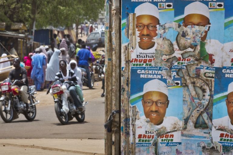 Campaign posters for opposition candidate Muhammadu Buhari plastered on the centre of a roundabout in northern Nigeria [AP]