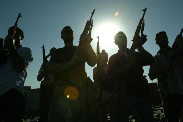 Members of a private security company pose on the rooftop of a house in Baghdad, September 2007 [Getty]