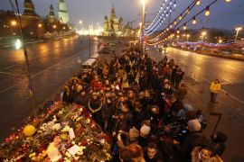 People gather at the site where Boris Nemtsov was recently murdered, in central Moscow