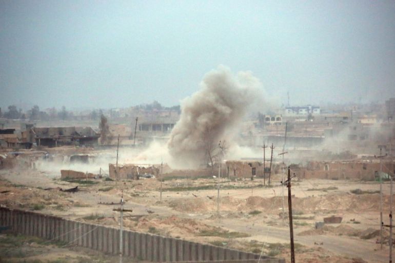 Smoke rises after clashes at Qadisiyah neighborhood in Tikrit [AP]