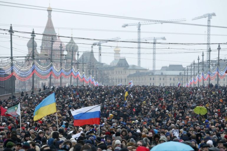 People march to commemorate Kremlin critic Nemtsov in central Moscow