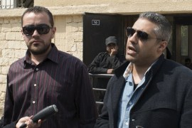 Al Jazeera television journalists Fahmy and Mohamed speak to the media outside of a court in Cairo