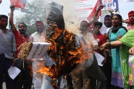 Activists burn an effigy representing the rapists convicted in the gang rape in a moving bus in New Delhi, in Hyderabad, India [AP]
