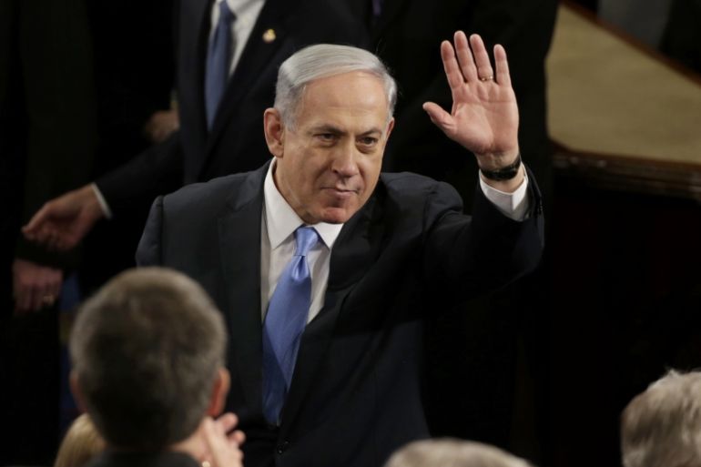 Israeli Prime Minister Netanyahu waves prior to addressing a joint meeting of Congress on Capitol Hill in Washington