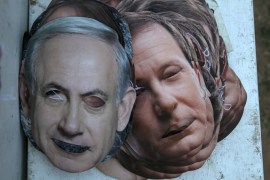 Masks depicting Israel''s Prime Minister Netanyahu and Isaac Herzog lie on the ground at the Yarkon park in Tel Aviv