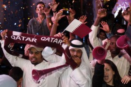 Qatari fans celebrate after the announcement that Qatar will host the 2022 World Cup