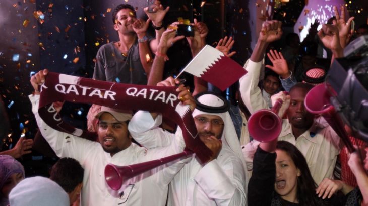 Qatari fans celebrate after the announcement that Qatar will host the 2022 World Cup