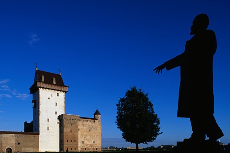 Narva fortress, 13th century, with the statue of Vladimir Lenin in the foreground, Narva, Estonia [Getty]