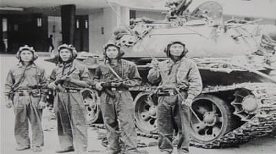 A picture of a photo of the North Vietnamese tank unit which barrelled thorough the gates of Saigon's Presidential Palace on April 30, 1975, and raised the North Vietnamese flag over the building 