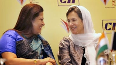 Afghanistan's first lady Rula Ghani speaks with an Indian MP at a New Delhi conference [EPA]